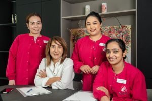 Dr. Najat Hazimeh with clinic team members at Najat Hazimeh Clinic, Dubai women’s health specialists