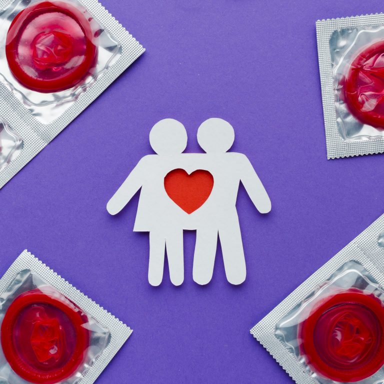 arrangement-contraception-concept-with-red-condoms-paper-couple